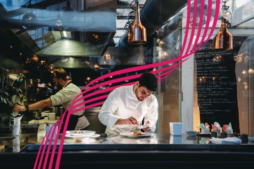 A chef is cooking in his restaurant's kitchen. High-end gourmet restaurant.