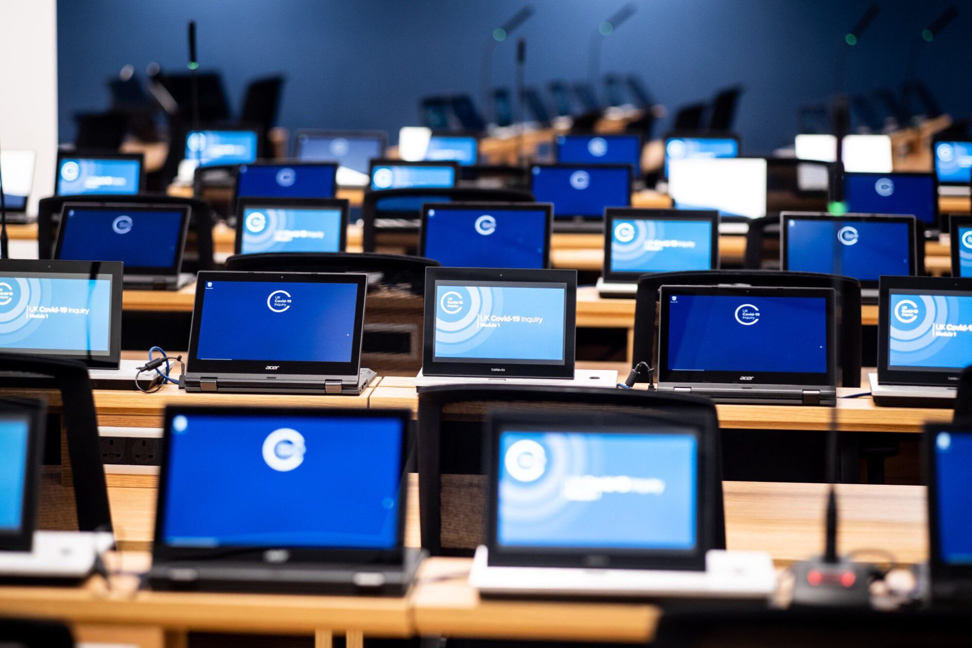 Monitors at the Covid-19 Inquiry in London