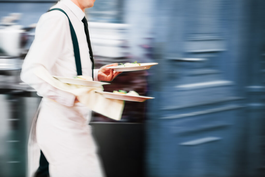 Waiter serving in a restaurant